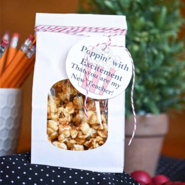 A paper container of caramel corn.
