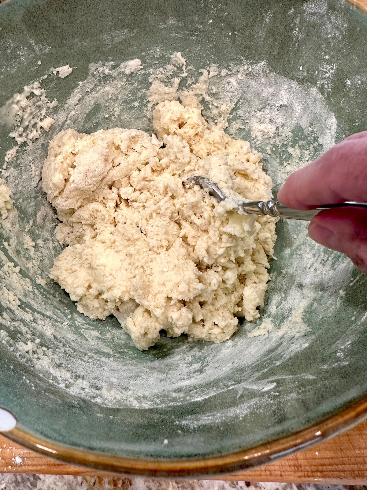 Homemade biscuit dough without yeast in a mixing bowl.