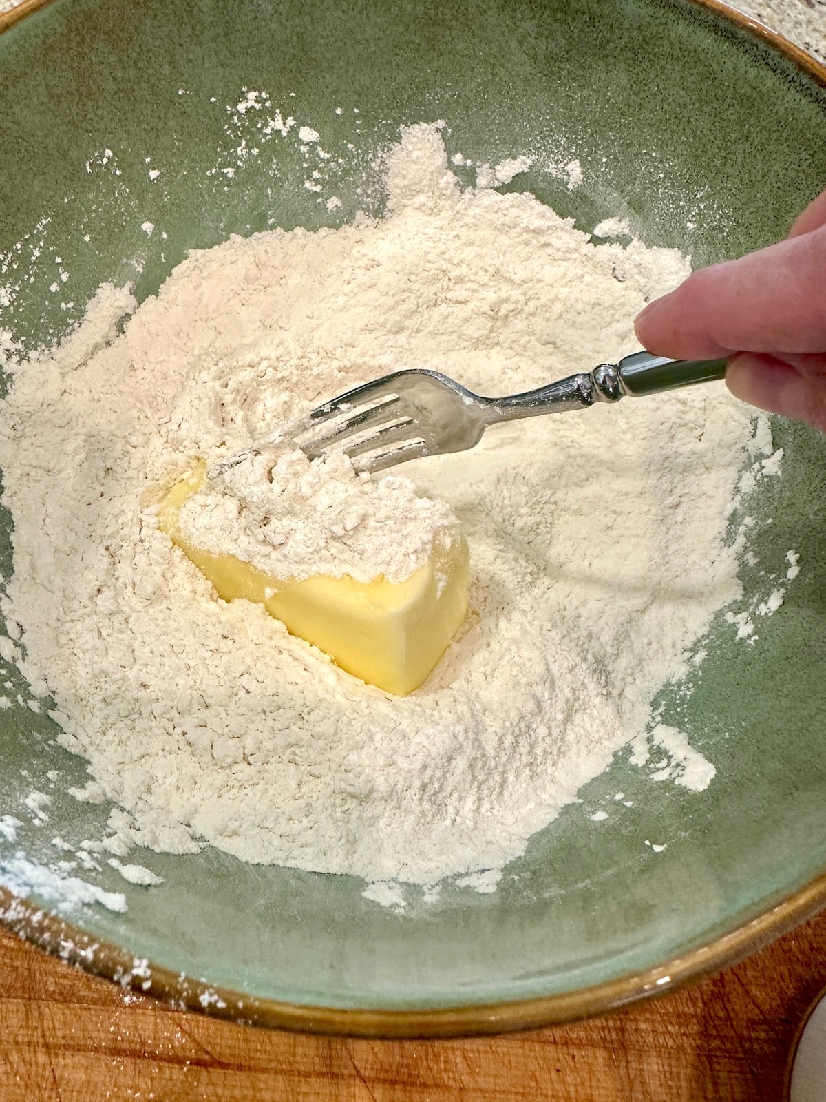 Dry ingredients with butter in a bowl.