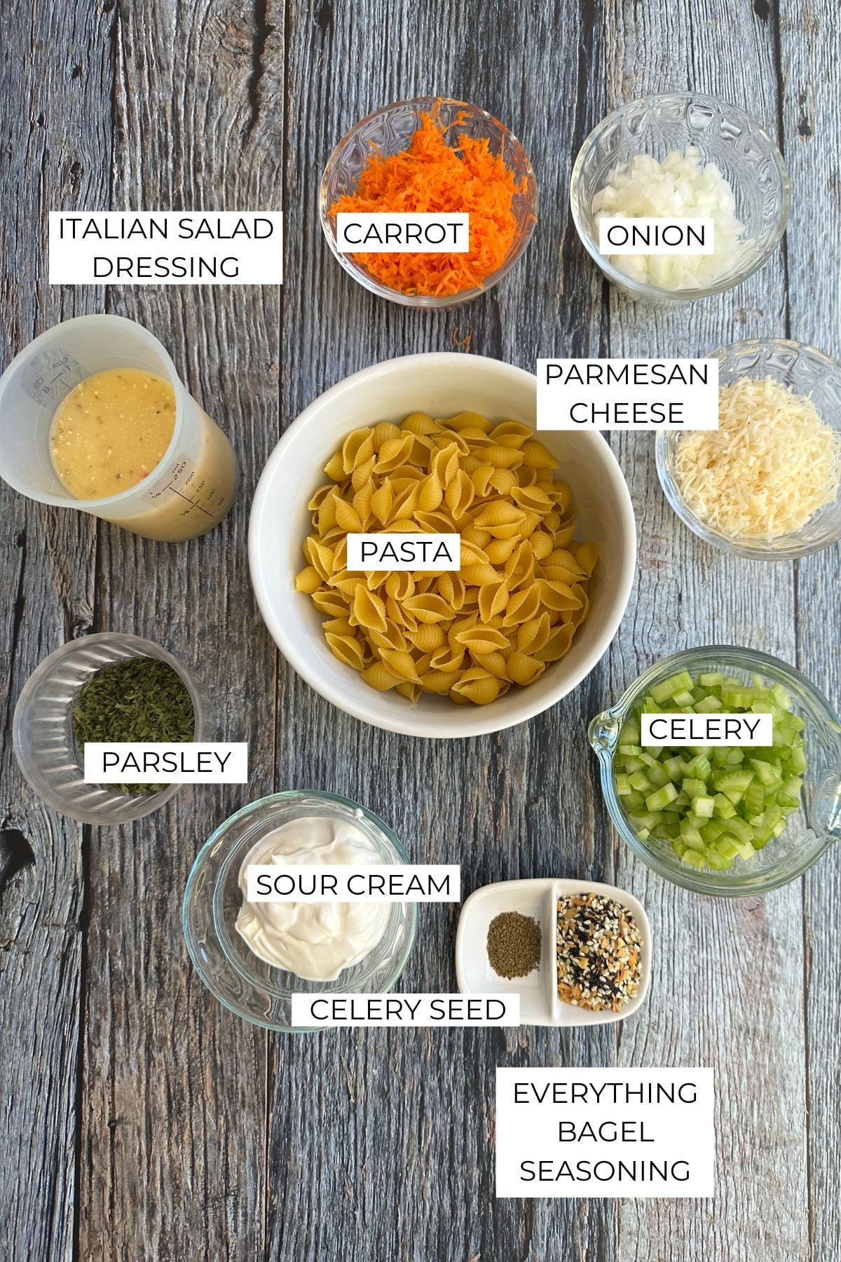 Labeled ingredients for pasta salad with Italian dressing.