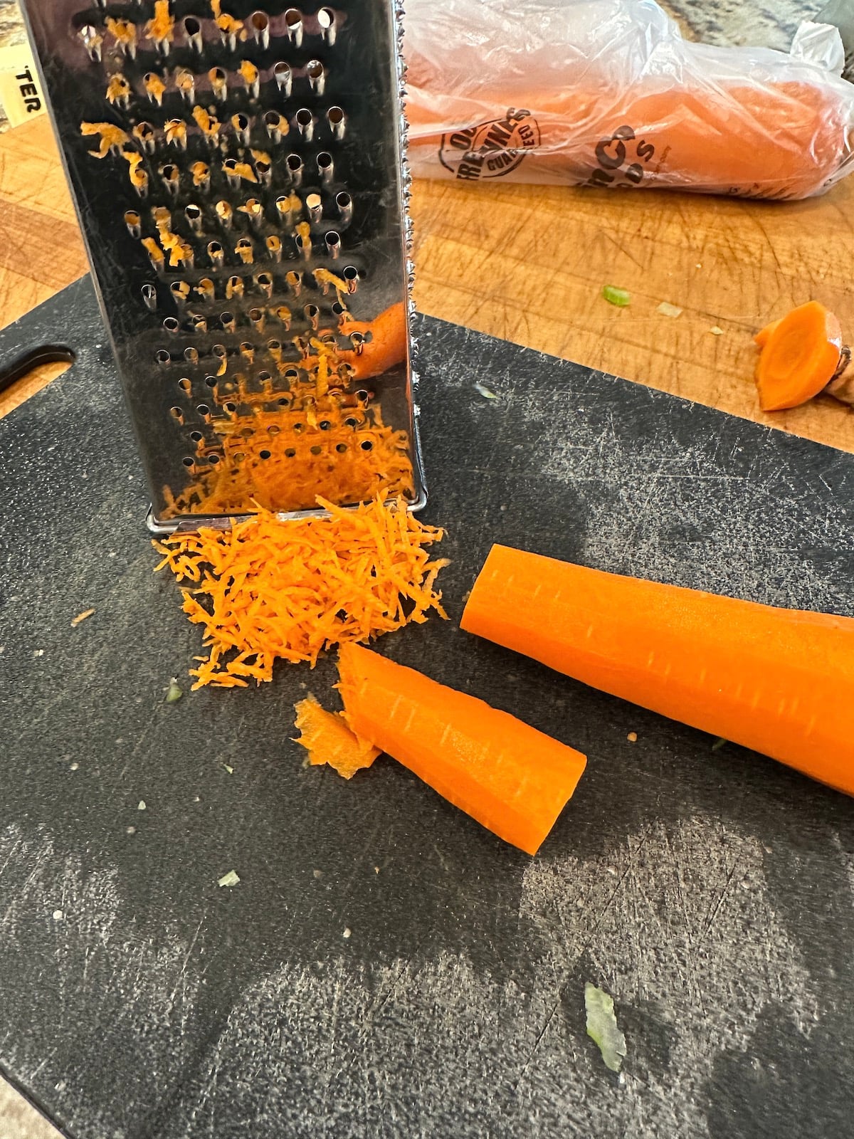 Carrots grated on a cutting board.