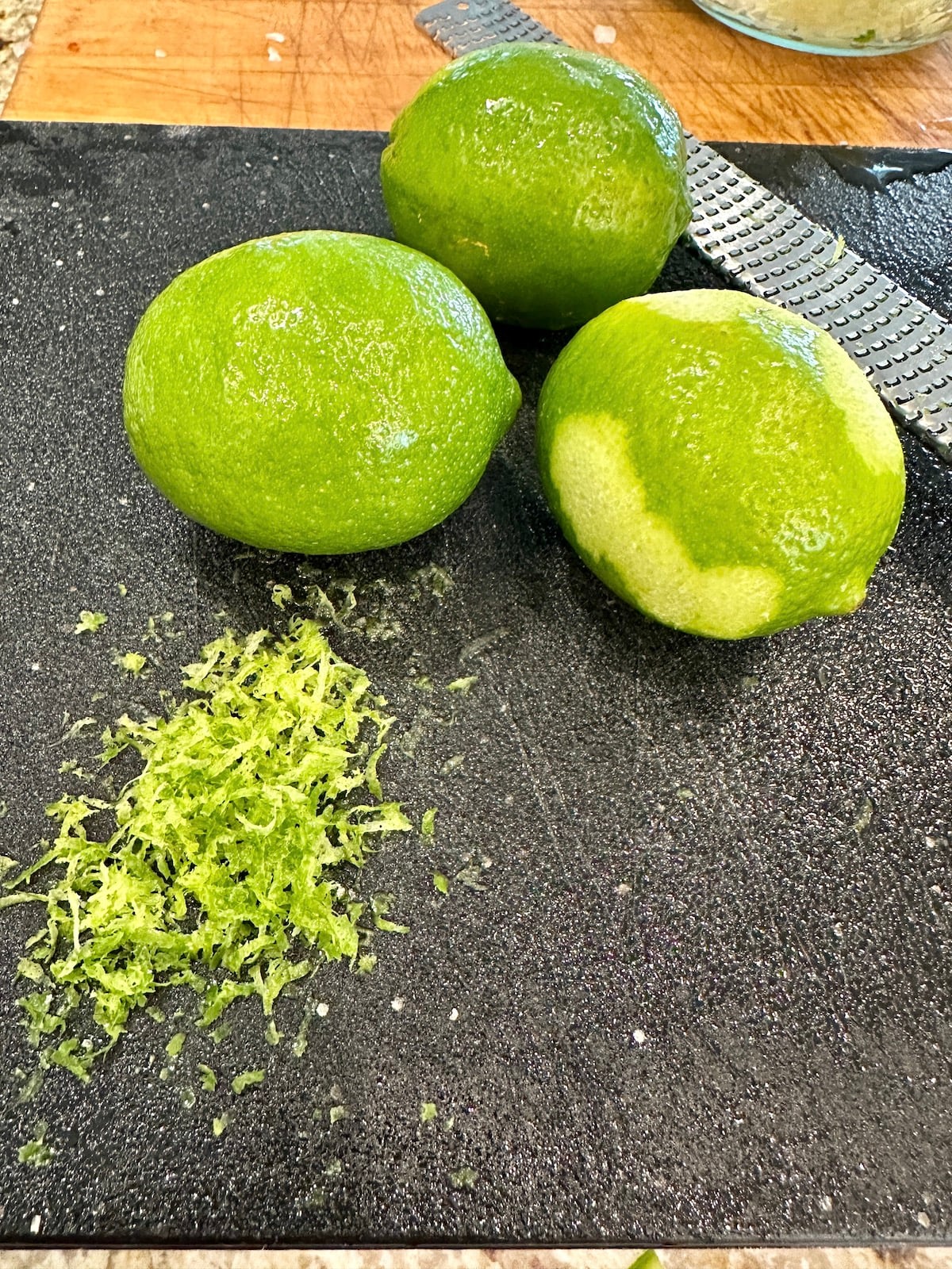 Limes on a cutting board.