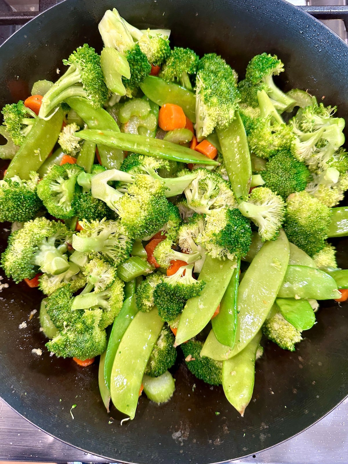 Cooked vegetables in a pan.